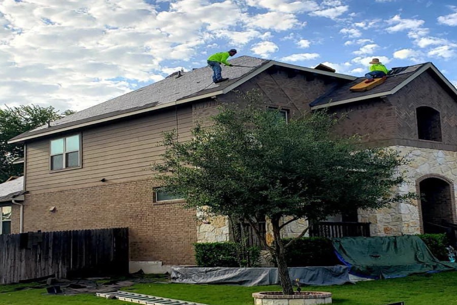 roofers installing new tiles